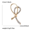 Elegante broche de nudo dorado con diamantes de imitación y medidas en cm - Dorado