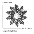 Elegant vintage snowflake brooch with black rhinestones and a white pearl center - Black