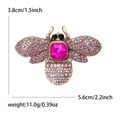 Golden alloy bee brooch featuring a large pink crystal and sparkling colorful rhinestones - Pink Style