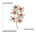Elegant gold-tone flower brooch with white and red crystals measuring 5.1cm by 3.2cm - Red Flower Style (MM-BR-5132-RD)