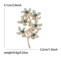 Elegant emerald green flower branch brooch in gold finish with white rhinestones - Green Flower Style (MM-BR-5132-GN)