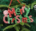 Glittering Merry Christmas hanging sign in red and green with white star patterns - Red and Green