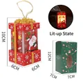 Close-up of LED light-up red Christmas gift box ornament with Santa Claus and size details - Gift Box Light / Red Santa Claus