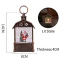 Vintage bronze Christmas lantern with Santa scene and LED warm light effect - Santa Claus Interior