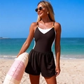 Detail of black and white one-piece swimsuit with golden ring and beach accessories - S / Coffee