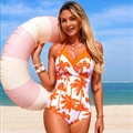 Women's one-piece swimsuit featuring orange palm tree prints and halter neck design - S / Orange