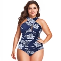 Detail of cross-neck one-piece swimsuit featuring blue floral print and teardrop cutout - XL / Blue Floral Print