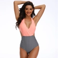 Detail of deep V-neck peach pink top and high-waist black white striped monokini - S / Striped