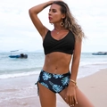 Close-up detail of high-waisted bikini bottoms with tropical green leaf floral pattern print - S / Top And Bottom / Black Leaf