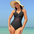 Detail of black one-piece swimsuit with halter neck and sheer mesh paneling in beach setting - S / Black (221023)