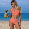 Detail of coral high-waisted bikini with ruched bottoms and wrap top on beach - S / Top And Bottom / Orange