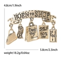 Golden retro Born to Shop brooch with fashion handbag and credit card charms - Gold