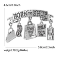 Vintage silver shopping themed brooch with charms like handbags and sale tags - Silver