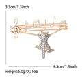 Golden music cat brooch with treble clef and note design, 3.3x4.5cm alloy jewelry piece - Gold