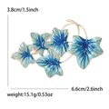 Elegante Brosche mit blauen Emaille-Blättern in Goldoptik mit Größen- und Gewichtsangaben - Blau