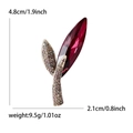 Elegant leaf brooch with ruby-tone faceted crystal and champagne rhinestones in gold setting - Purple