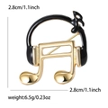 Detail van de muzieknootbroche met afmetingen van 2,8 cm en informatie over het gewicht - Zwart