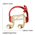Minimalistische koptelefoon en muzieknoot speld met rood emaille in goudkleur - Rood