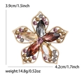 Elegant hollow flower brooch with colorful rhinestones in a gold-plated setting - Purple