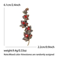 Vintage gold vine brooch with red rhinestones, measures 6.1cm by 2.2cm and weighs 9.4g - Multicolor (5079-MX)