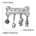 Vintage silver dog bone brooch with hanging pet charms including bowl and hydrant - Silver