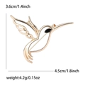 Golden minimalist hummingbird brooch with hollow wings and black rhinestone eye detail - Gold