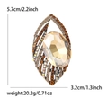 Elegante goldene Blatt-Augen-Brosche mit champagnerfarbenem Edelstein und bunten Strasssteinen - Braun