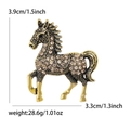 Spilla cavallo al galoppo in oro con strass champagne, altezza di 3,9 cm - Marrone