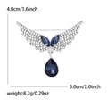 Broche de alas de ángel plateado con gemas azules y pedrería brillante, 5cm ancho - Azul