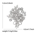 Elegant floral bouquet brooch with sparkling rhinestones in a silver-tone alloy setting - Silver-White