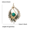 Detailed view of rhinestone peacock brooch with size measurements 6.0cm by 3.6cm - Gold Green Style (MM-BR-5297)