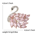 Elegant gold swan brooch with pink marquise crystals and white rhinestones, size 4.2cm - Pink