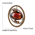 Elegant vintage gold planet brooch with oval reddish-brown gem and yellow rhinestones - 5365-BR / Brown