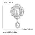 Detail view of vintage emerald cut glass brooch showing 7cm length and 15.3g weight - White K - Silver