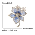 Elegant floral brooch with blue gradient petals and clear crystals in golden finish - Blue