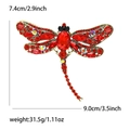 Detailed view of red dragonfly brooch with rhinestones showing dimensions 9.0cm by 7.4cm - Antique Gold Red