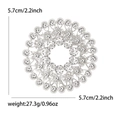 Silver rhinestone circle brooch for women, featuring a 2.2 inch hollow floral pattern design - Silver