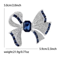 Silver bow brooch with white rhinestones and blue crystals, size 5.9x5.0cm - Silver-Blue