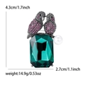 Parrot brooch with pink crystals, emerald-cut green stone, and white pearl accent - Gunmetal-Purple