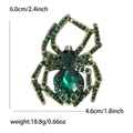 Detailed dimensions of a vintage gold spider brooch with green rhinestones and gems - Green