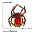 Detailed view of vintage gold spider brooch dimensions with red teardrop gemstone - Red