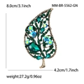 Detail view of leaf-shaped brooch with green crystals and dimension markings - Leaf Shape (5562-GN) / Vintage Gold-Green