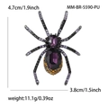 Detailweergave van paarse kristallen spinnenbroche met maten van 4,7 cm hoog en 3,8 cm breed - Paars