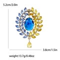 Vintage-Brosche in Gold mit blauen und gelben Steinen und Tropfenanhänger für Damenanzüge - Blau und Gelb