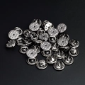 Macro detail of silver metal butterfly clutch pin backs for badges and brooches - Silver