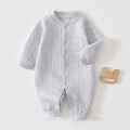 Close-up of quilted light blue baby romper with star patterns and moon embroidery - Thermal Fog Blue Star Moon Romper