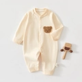 Detail of baby cotton romper with brown bear patch and convenient front snap buttons - 73 Size / Top And Bottom / Embroidered Bear