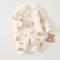 Close-up of quilted cream baby romper featuring cute bear prints and snap button closure - Cute Bear