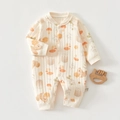 Close-up of baby romper waffle fabric with forest animal pattern and size label - Thermal Squirrel Eagle Romper