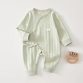 Detail of mint green newborn cotton romper with soft ribbed texture and bow ties - 52cm / Green (Wing)